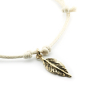Preview: Bernardes bracelet, Soul, silver Feather, offwhite cord, gold accents, detail