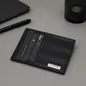 Preview: S.T. Dupont Kartenetui James Bond 007 mit Karten auf einem Schreibtisch mit Stift und Notizbuch, Trixi Gronau, KI-Visualisierung