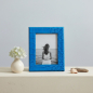 Preview: Lionetti Francesco picture frame azure blue croco leather with black-and-white photo of a woman by the sea and hydrangea