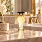 Preview: Lubin Paris Eau de Parfum KISMET, flacon with black cap on a marble washstand