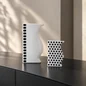 Preview: Reichenbach ASTI and ASTA black and white porcelain vases displayed on a dark console