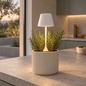 Preview: Sompex PEEKY white rechargeable plant lamp placed in a rosemary planter, background AI visualisation