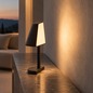Preview: Sompex TWIN Schwarz auf schmaler Konsole mit warmem Lichtschein an der Wand, KI-gestaltete Wohnszene
