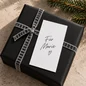 Preview: Weiße Rückseite der TRIXI GRONAU Mini-Weihnachtskarte mit handschriftlichem Gruß auf schwarzem Geschenk mit grauem Samtband