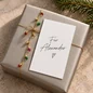 Preview: Weiße Rückseite der TRIXI GRONAU Mini-Weihnachtskarte mit handschriftlichem Beispiel Für Alexander