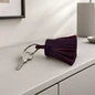 Preview: Trixi Gronau key fob leather tassel LOTTA aubergine with key on a sideboard, AI visualisation