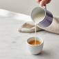 Preview: Reichenbach COLOUR II mini pitcher lilac pouring milk over espresso