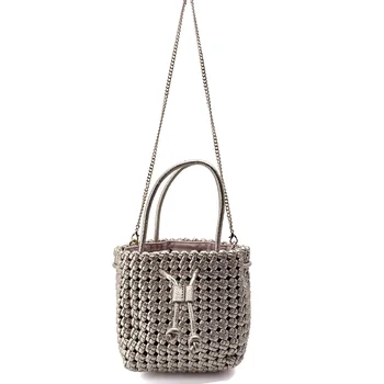 Vimoda Cleo hanging from its gold-tone chain, woven texture seen from the front