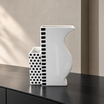 Reichenbach ASTI dotted vase paired with the taller ASTA black striped porcelain vase