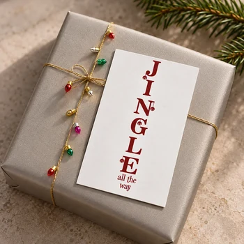 Preview: Mini-Weihnachtskarte Jingle All the Way auf champagnerfarbenem Geschenk mit Vivant Geschenkband FAUX LIGHT