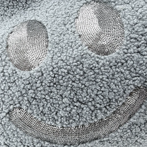 Nahaufnahme des matten dunkelgrauen Pailletten-Smileys