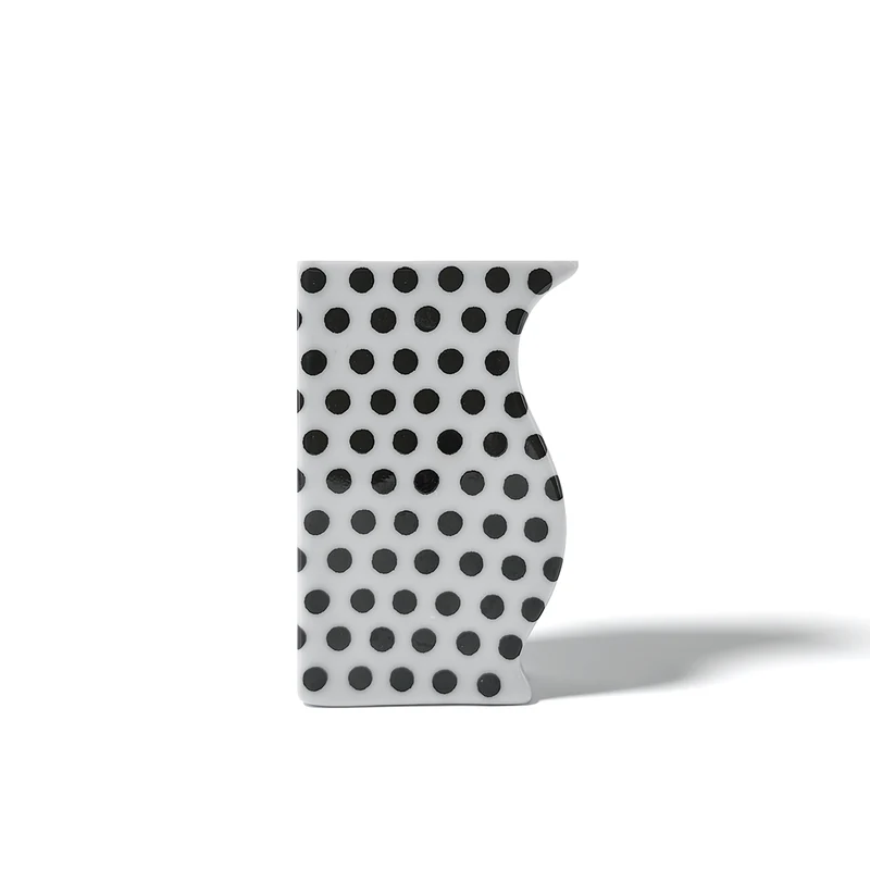 Reichenbach ASTI white porcelain vase with all-over black dots and asymmetrical sculptural silhouette