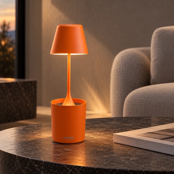 Sompex PEEKY orange rechargeable lamp with warm light on a dark side table, AI-generated living room