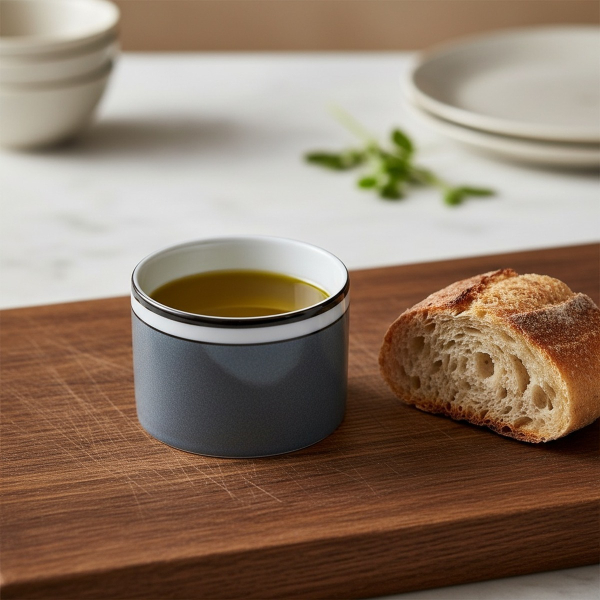 Reichenbach COLOUR II small dip bowl grey with olive oil on oak wood