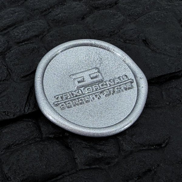 Silver seal on a black croco cover
