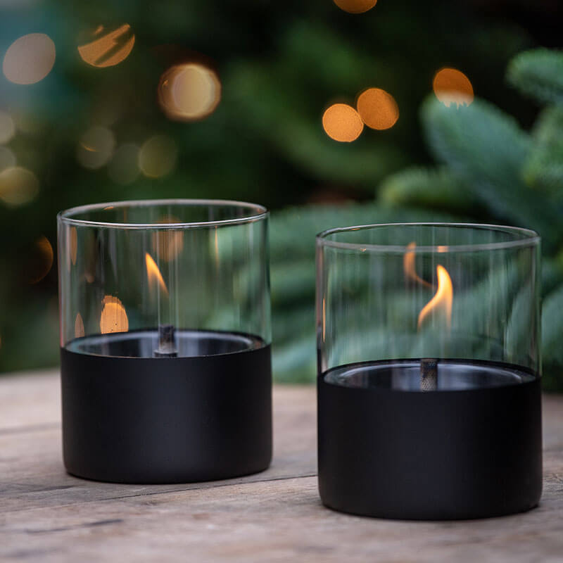 Two Tenderflame table lamps with a real flame outdoors