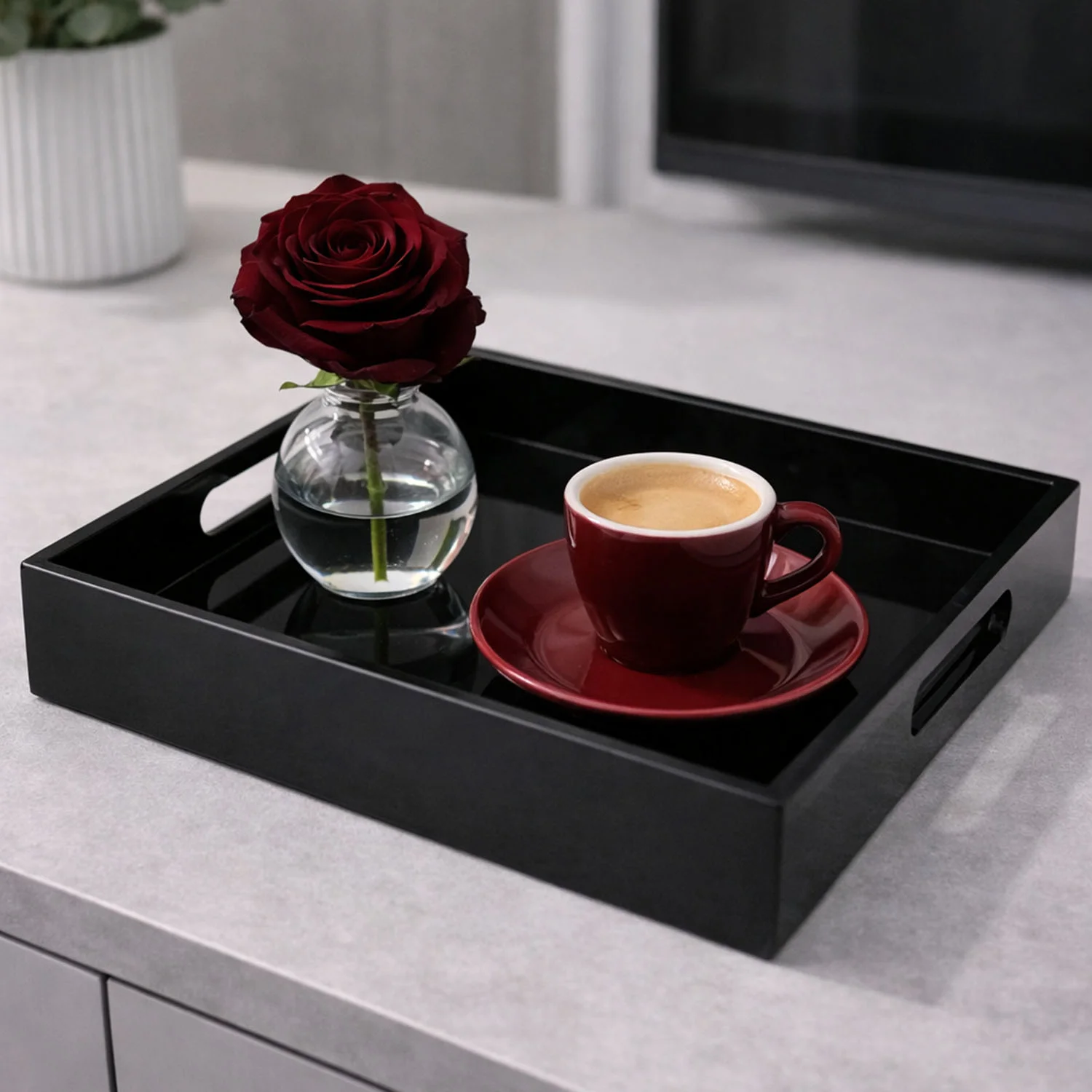 Black tray with a red cup and a rose as a motif for casual fine dining