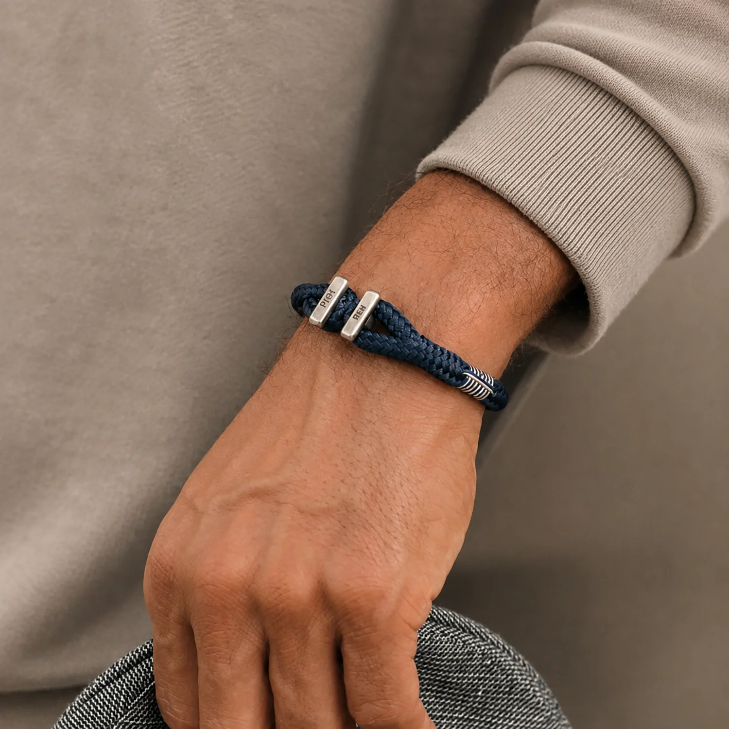 Pig & Hen Icy Ike bracelet in navy and silver worn on the wrist as a Christmas gift for men