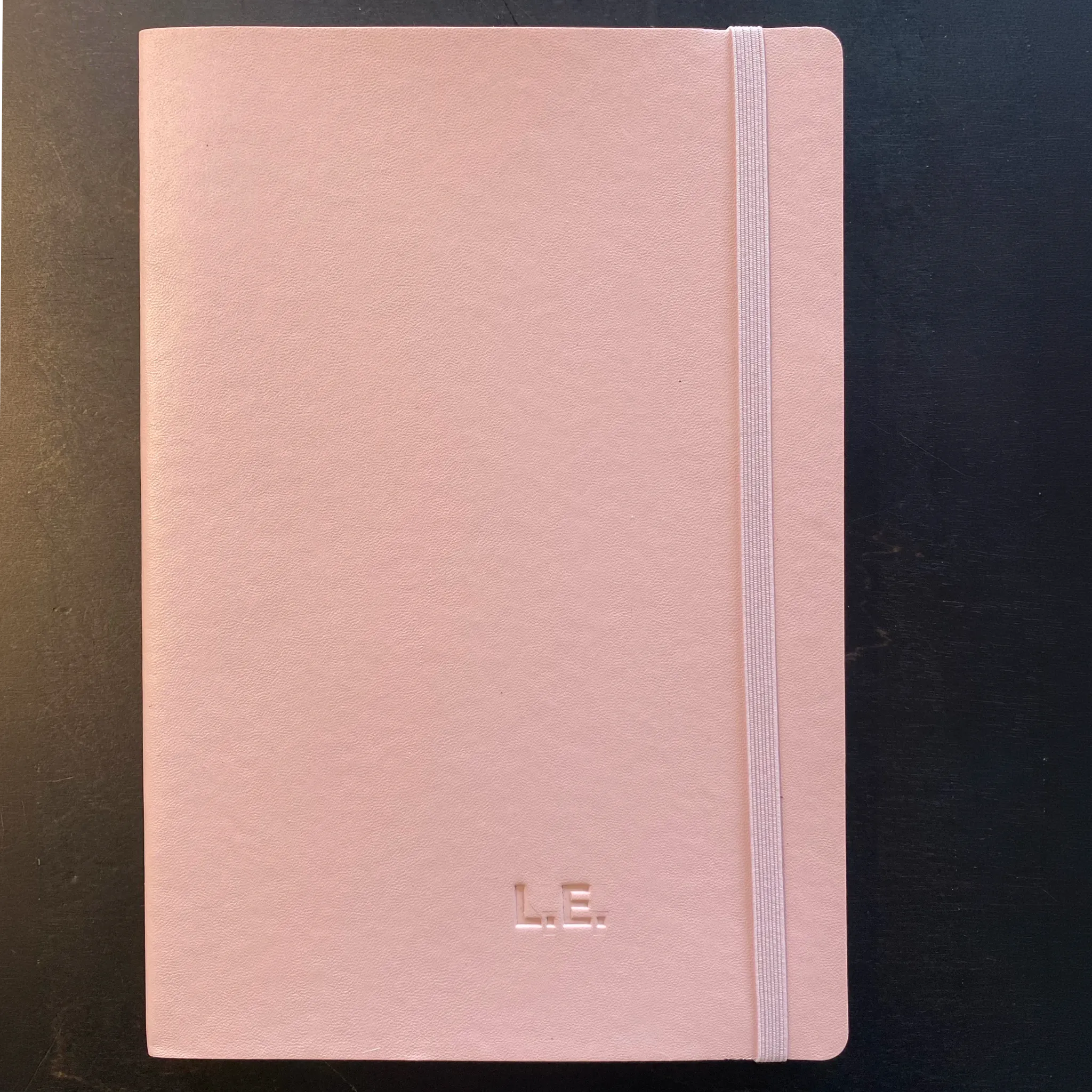 Pink notebook with blind embossed initials L.E. from the TRIXI GRONAU atelier