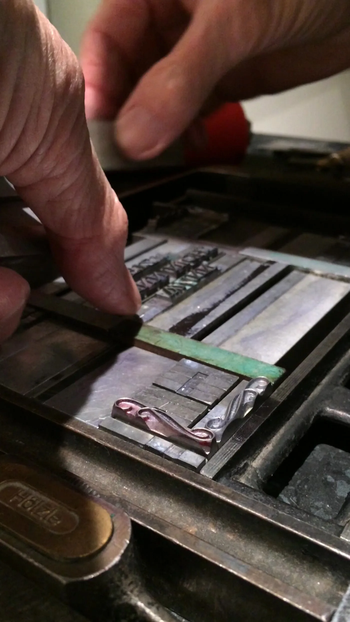 Lead type being composed by hand for letterpress printing