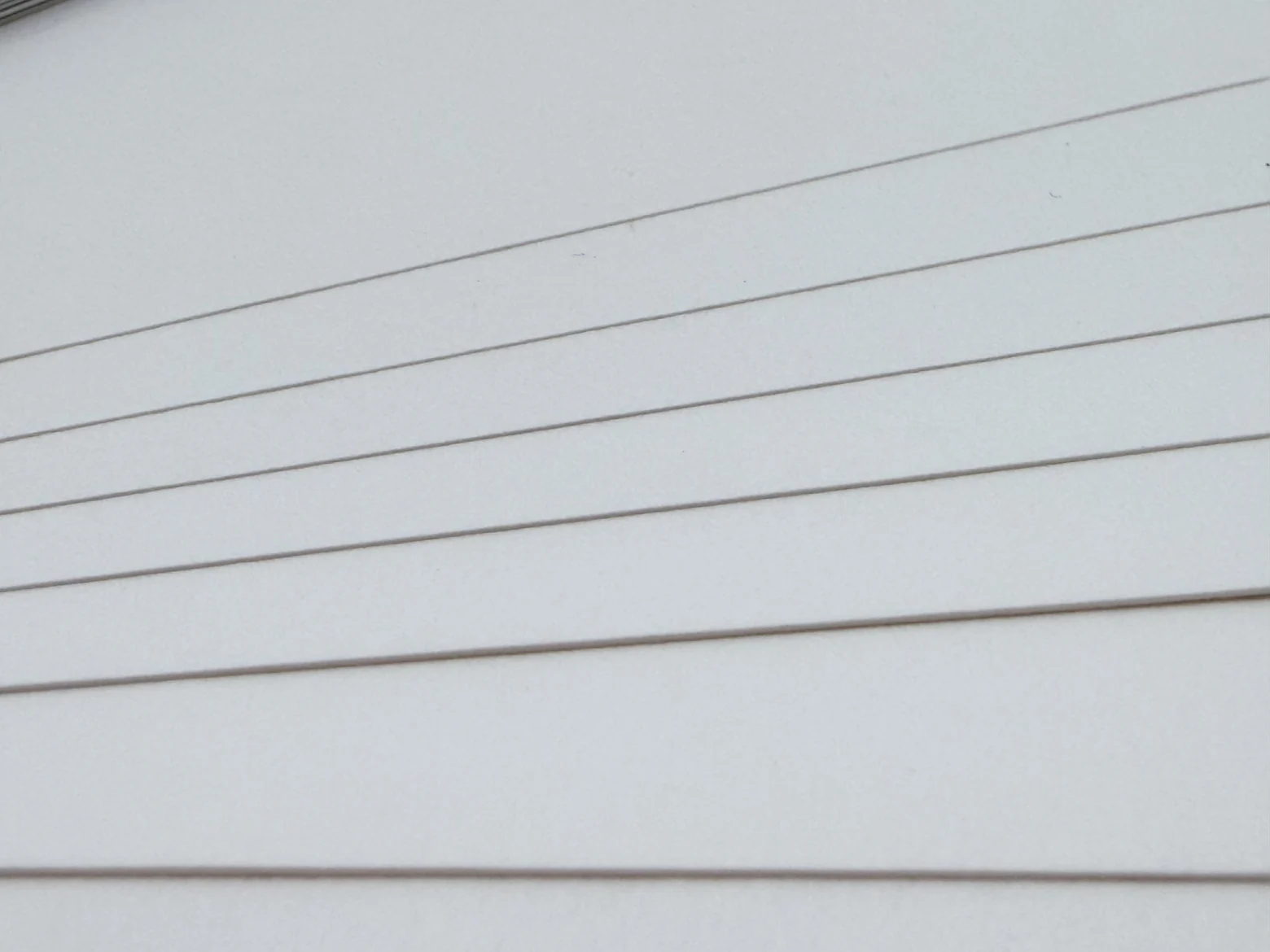 Fanned out sheet edges showing the different paper thicknesses